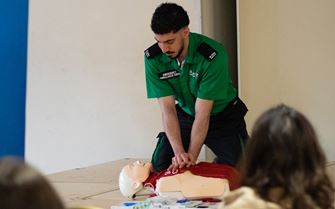 St John volunteer demonstrating how to save a life