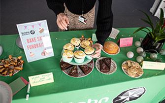 An arrangement of baked treats on a table of a St John Ambulance fundraiser.
