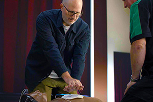 A man learning first aid skills.