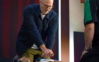 A man learning first aid skills.