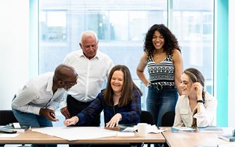 Course learners working together during a mental health first aid training course. Course learners working together during a mental health first aid training course.