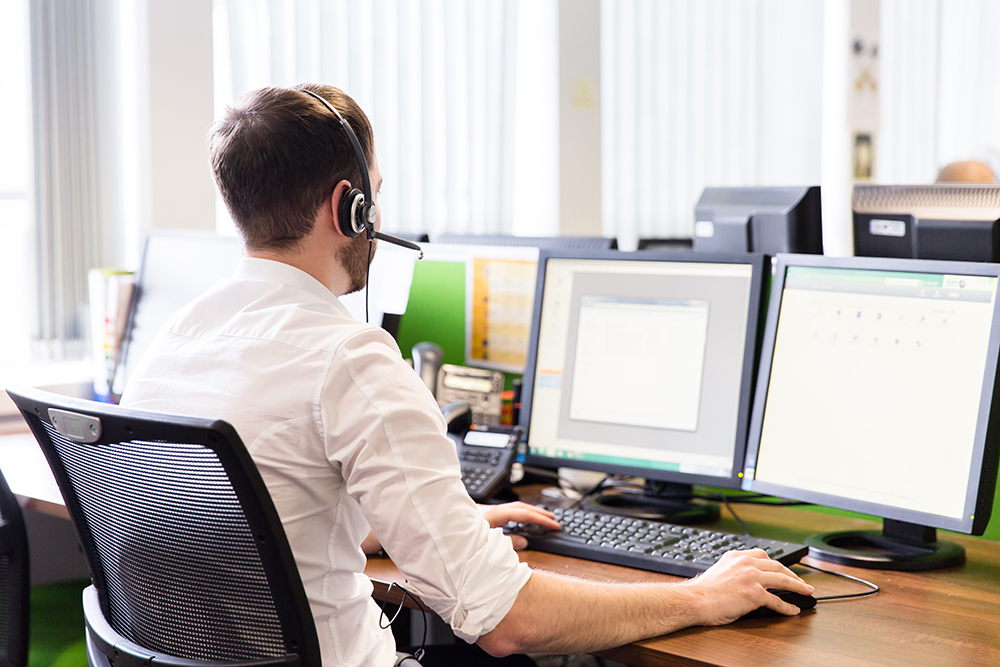 Employee working at a desk computer