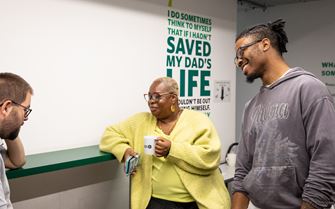 People having a conversation at work.