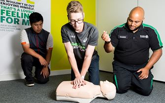 First aid course participants practicing CPR