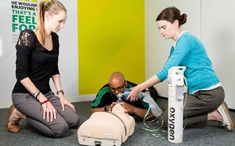 Course participants practicing how to administer oxygen